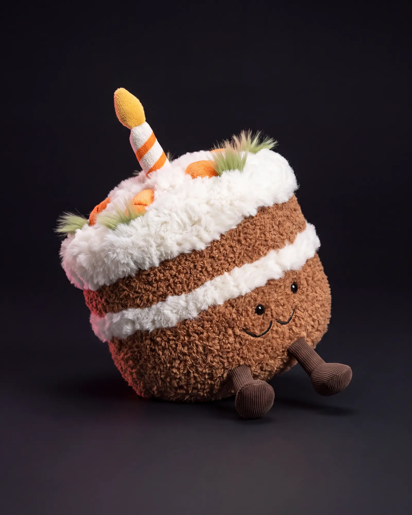 Amuseables Carrot Cake on a dark studio background.