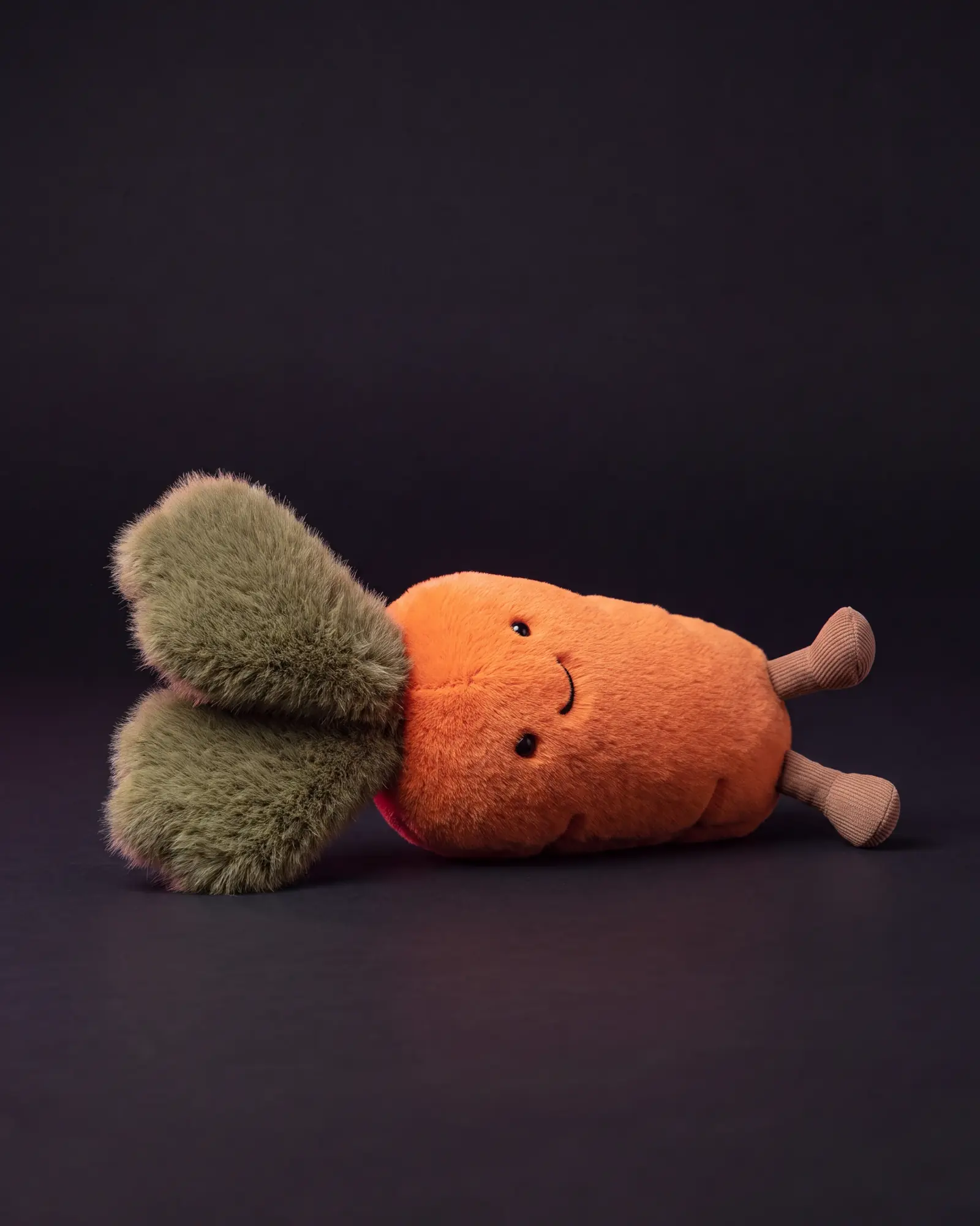 Amuseables Carrot on a dark studio background.