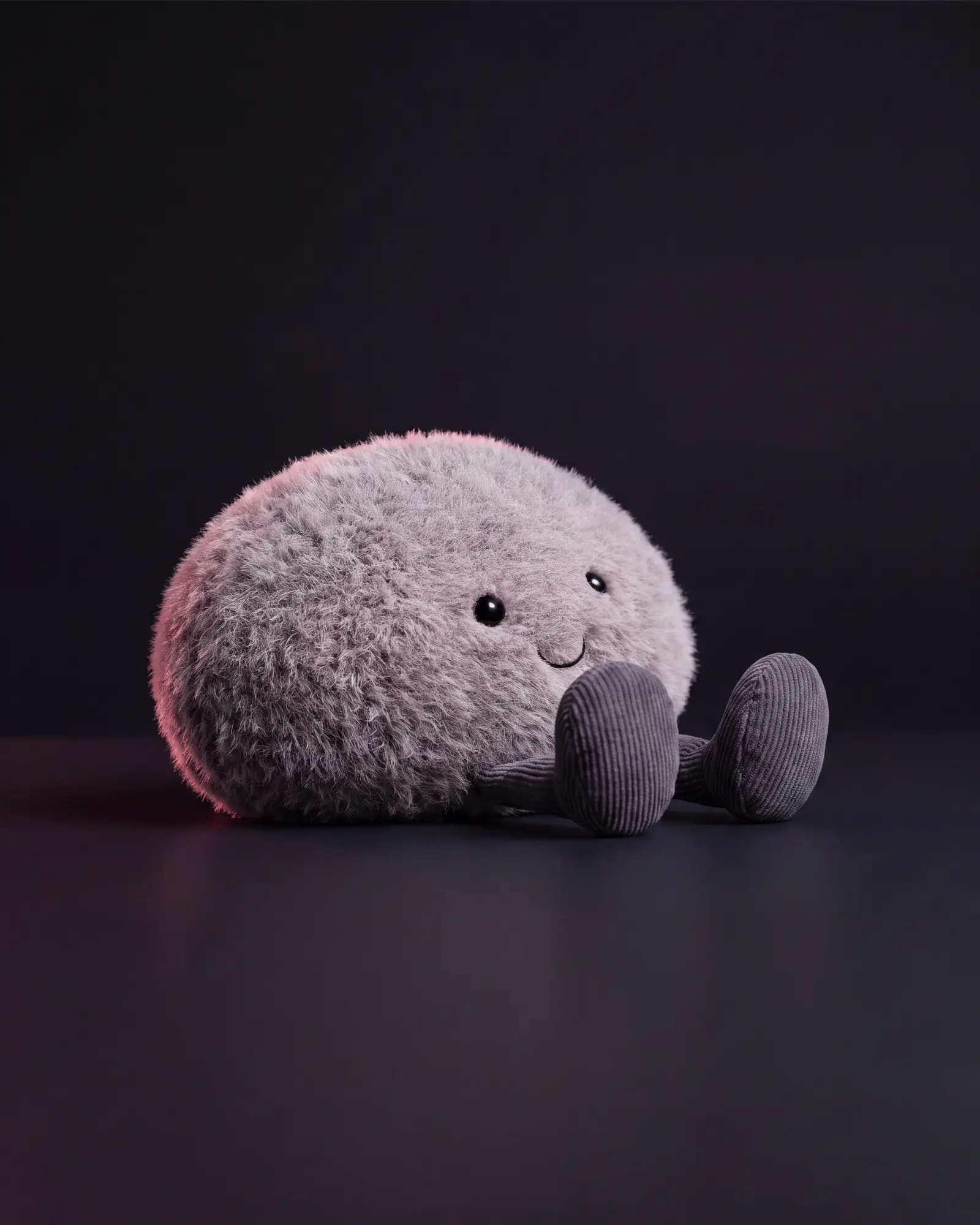 Amuseables Pebble on a dark studio background.