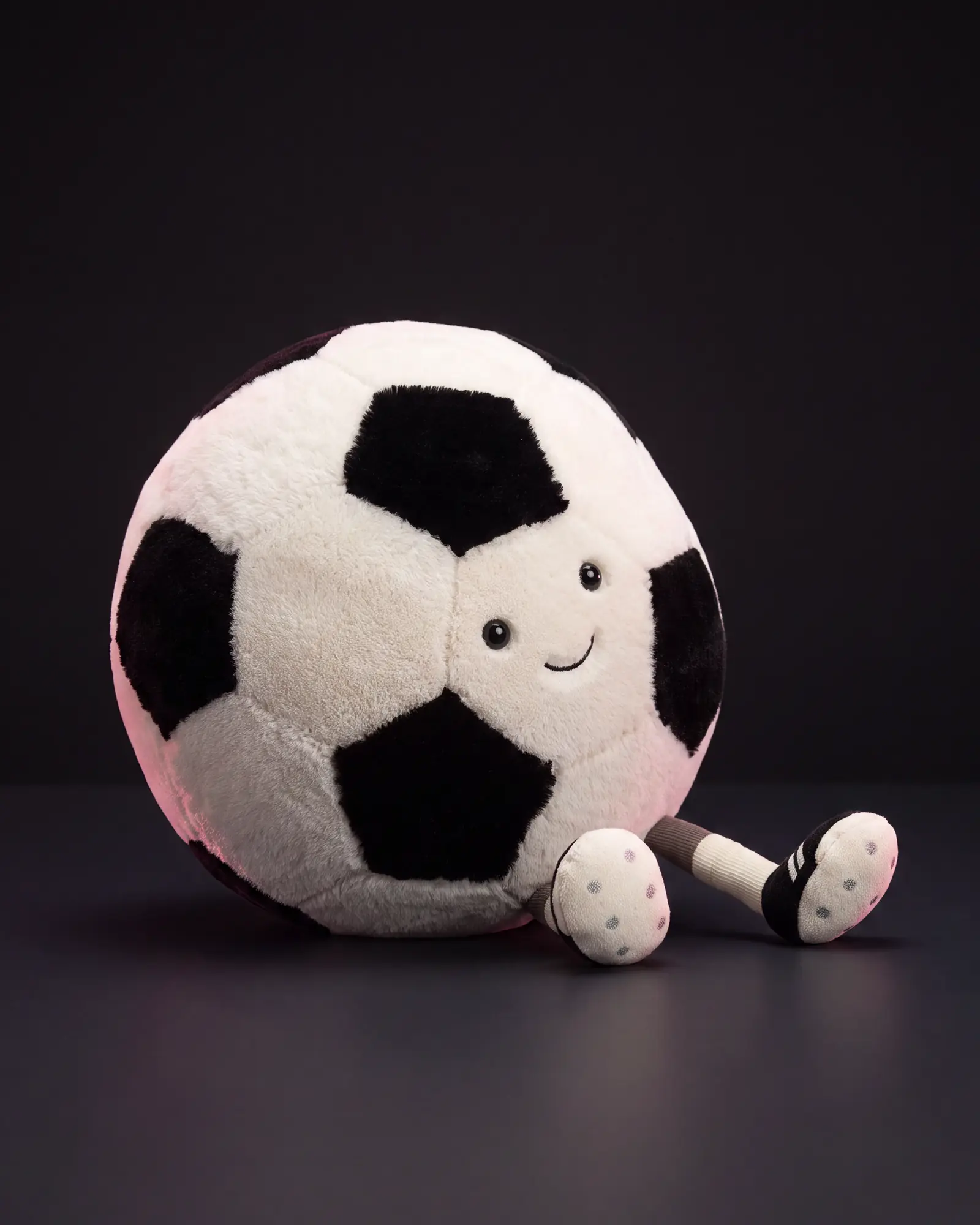 Amuseables Sports Football on a dark studio background.