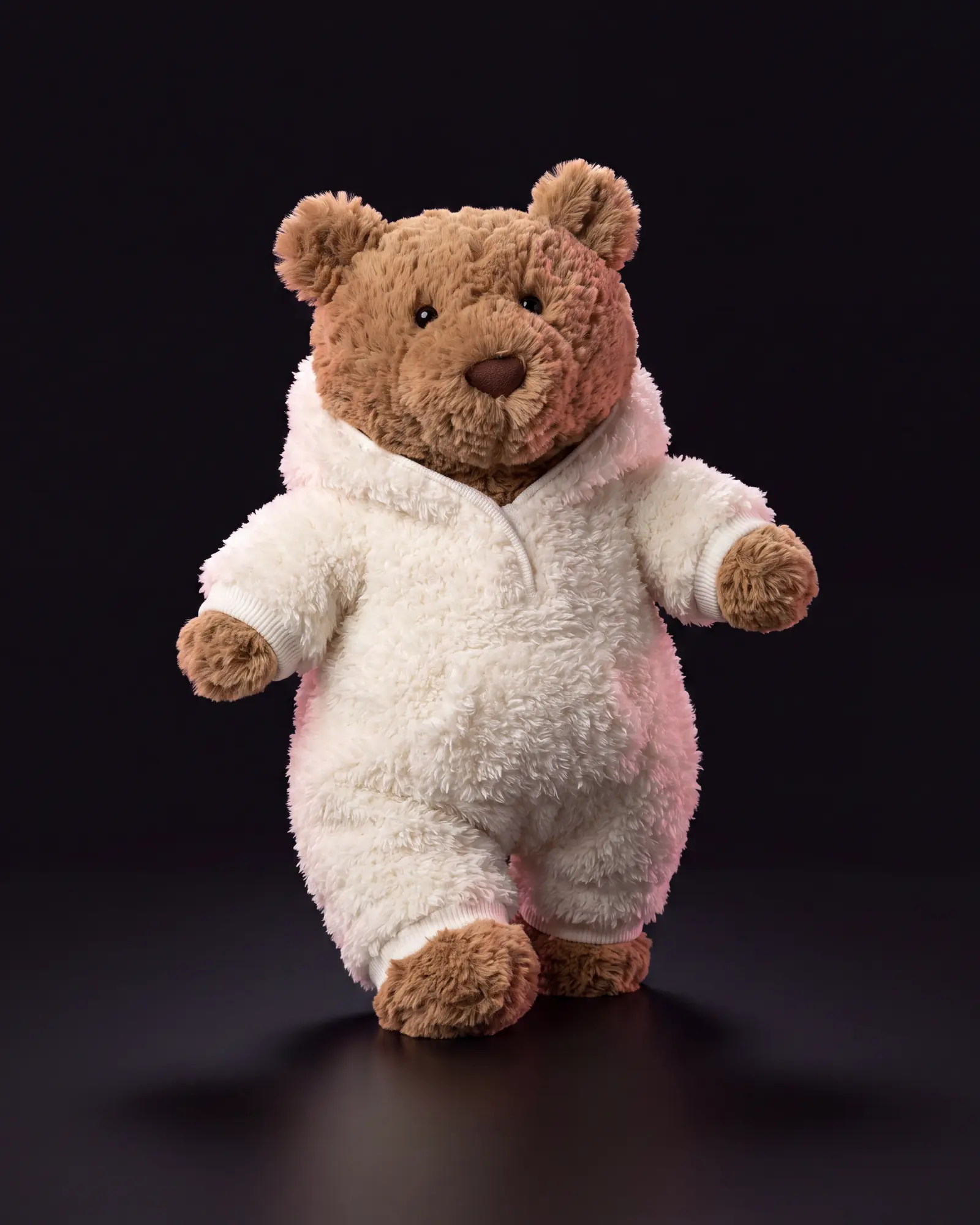 Bartholomew Bear ‘All-in-one’ on a dark studio background.