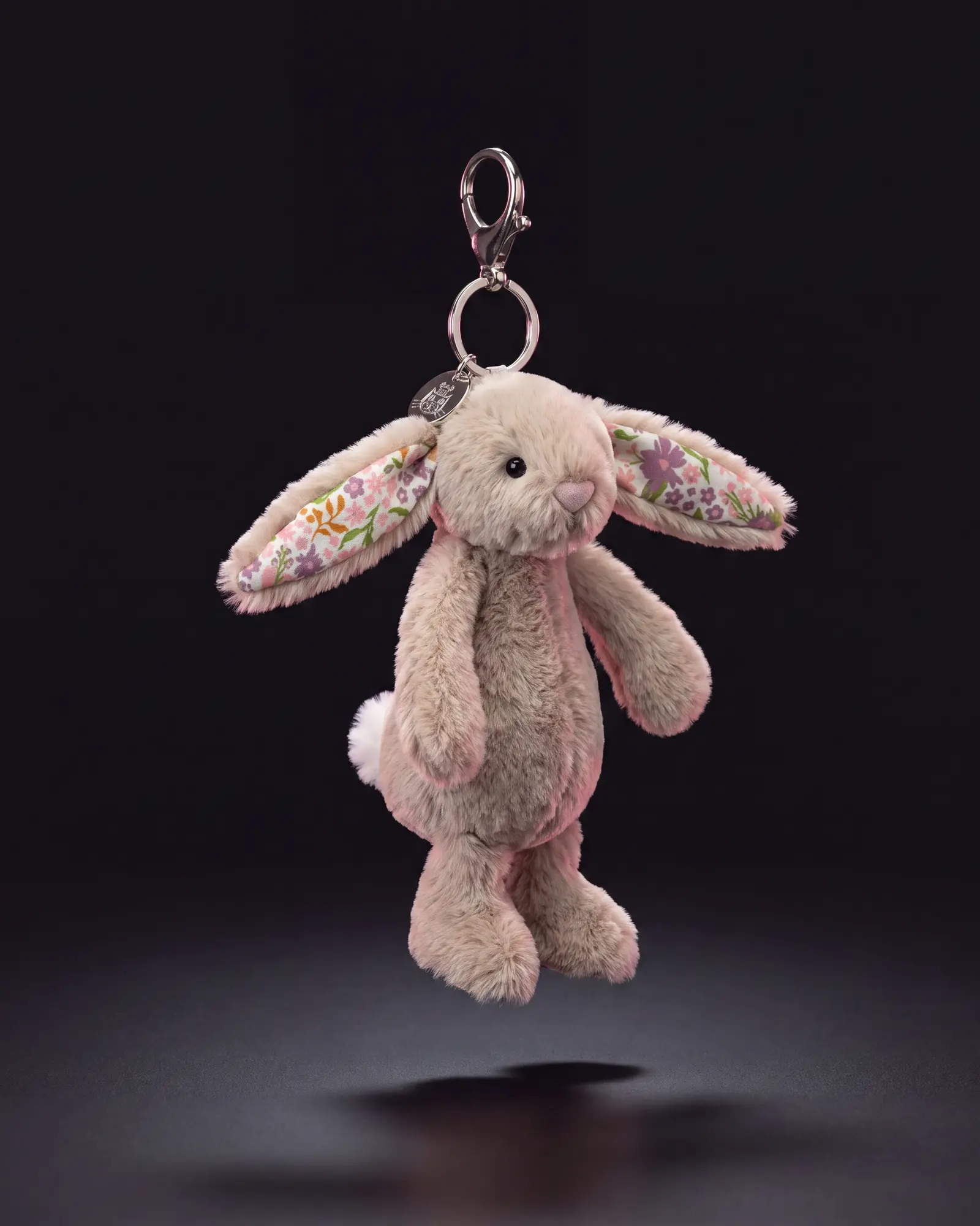 Blossom Beige Bunny 'Petal' Bag Charm on a dark studio background.