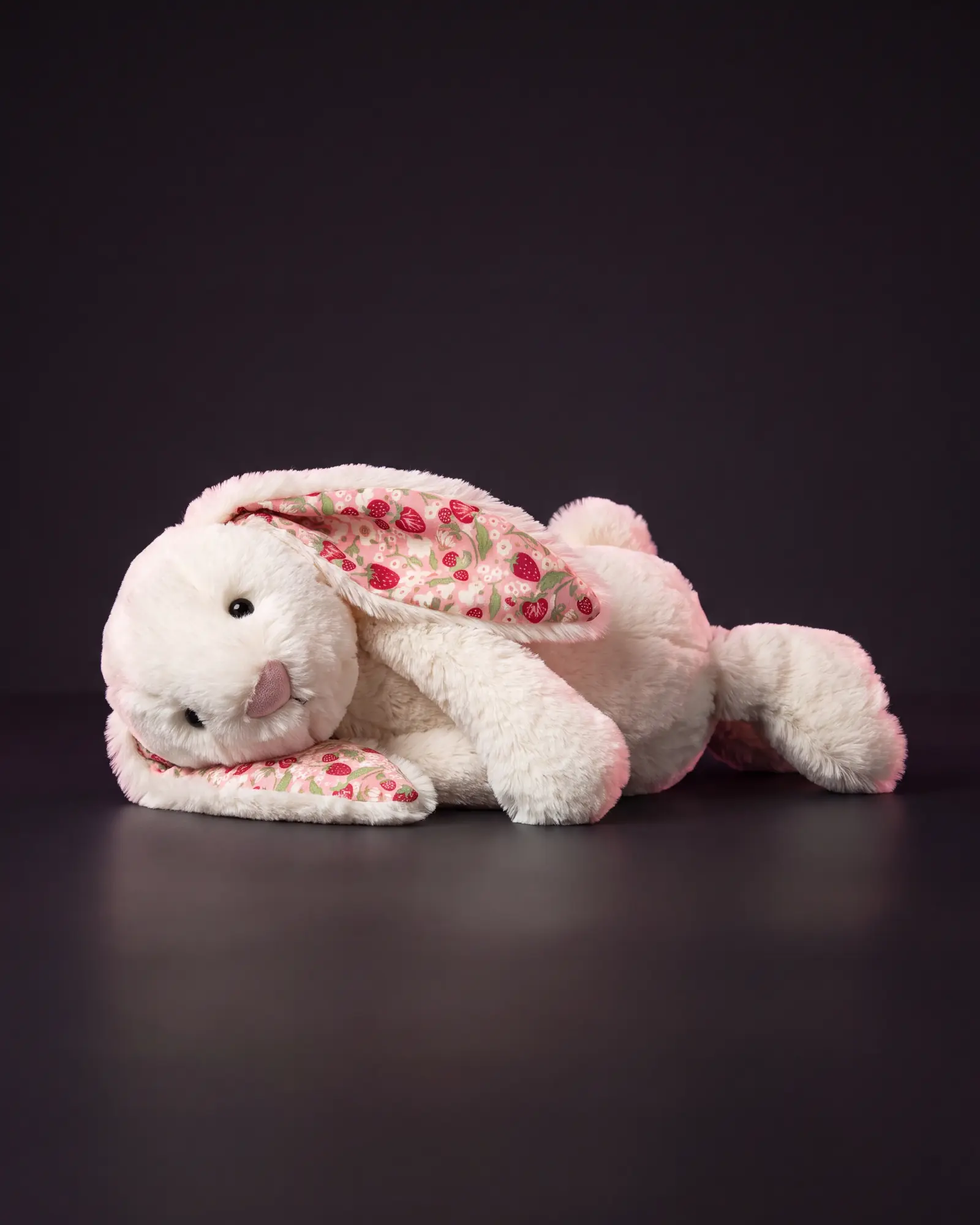 Blossom Cream Bunny 'Berry' on a dark studio background.