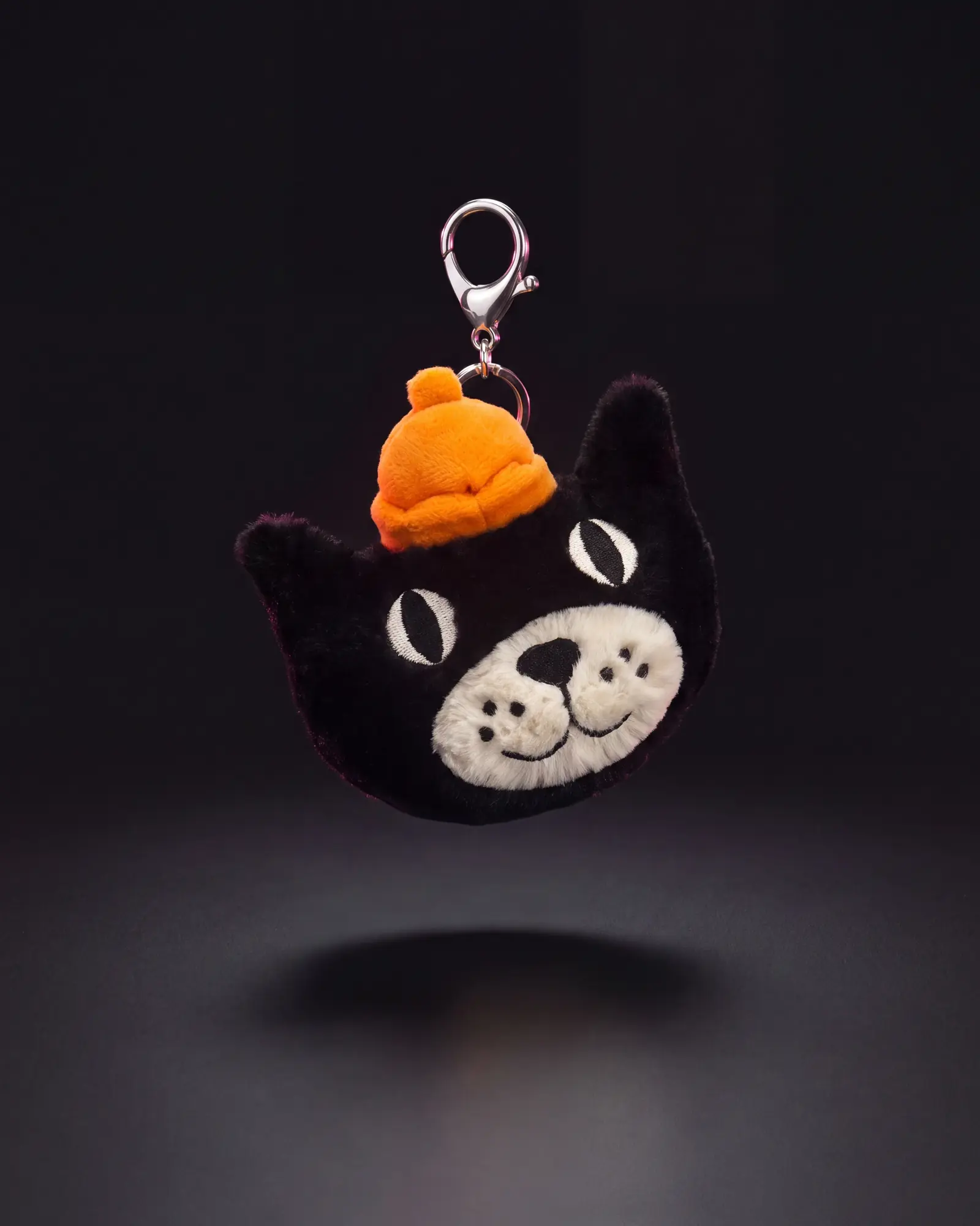 Jellycat Bag Charm on a dark studio background.